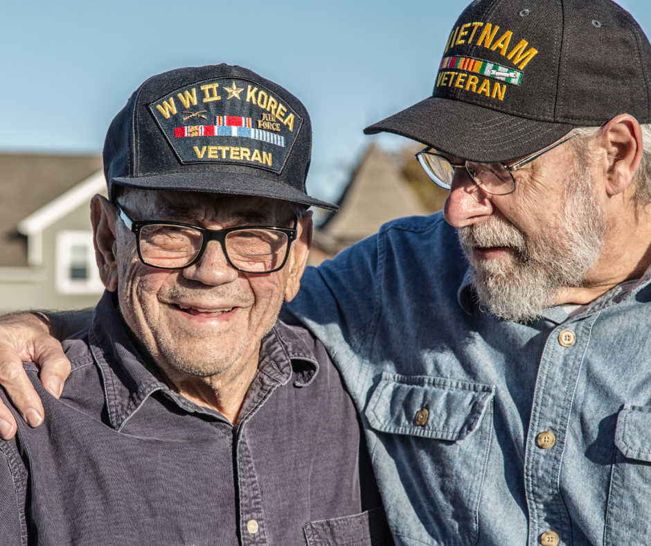Old veterans hugging and smiling