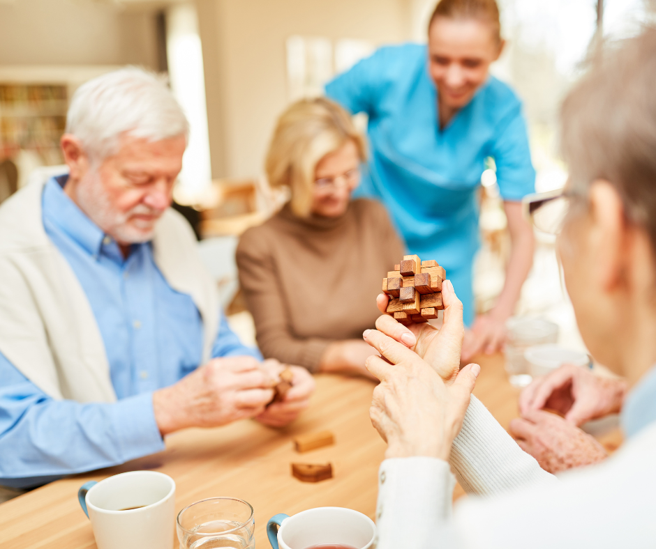 Older people playing a game at a table