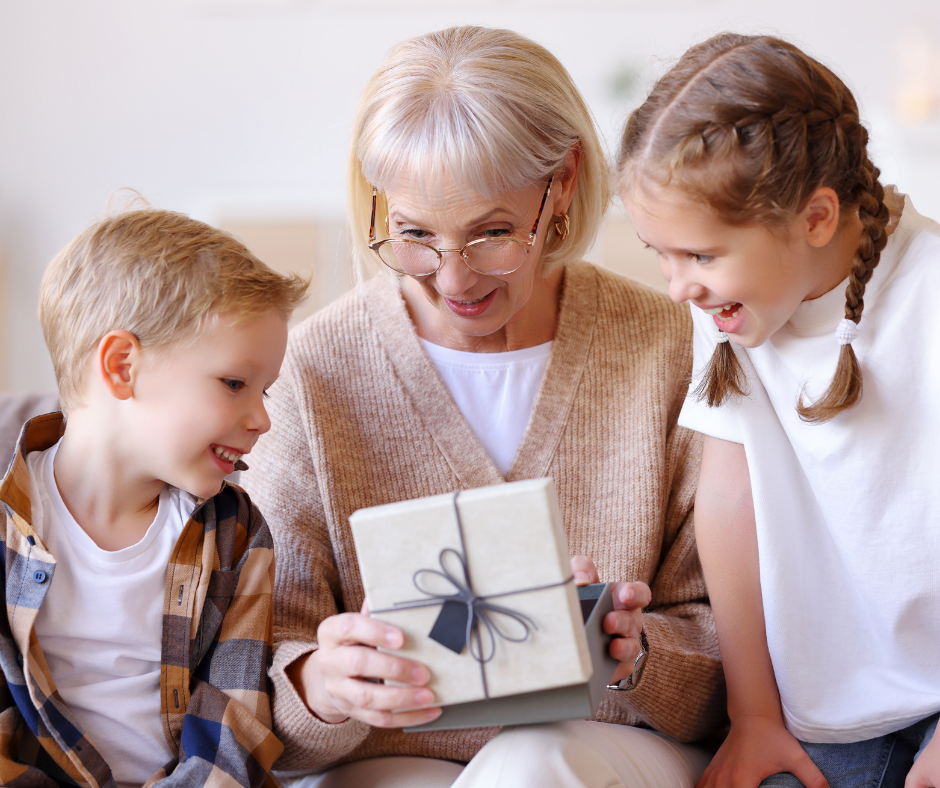 grandparent and children with holiday present